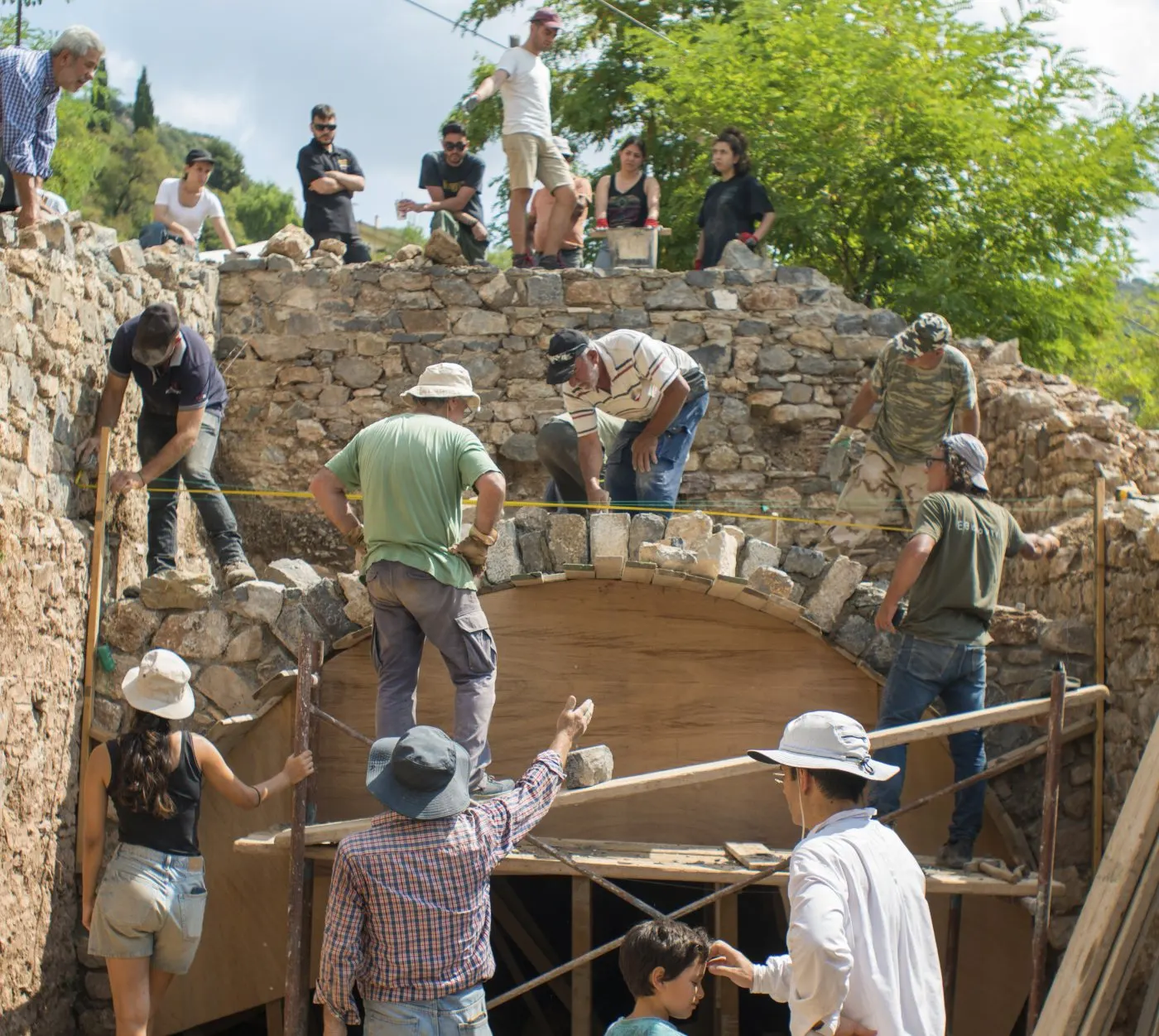 Trainees and masters turning the arch of a traditional Lagkadian house