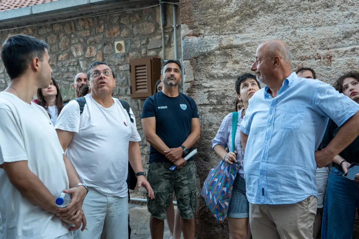 Participants gathered in the courtyard at the Rigopouleiko